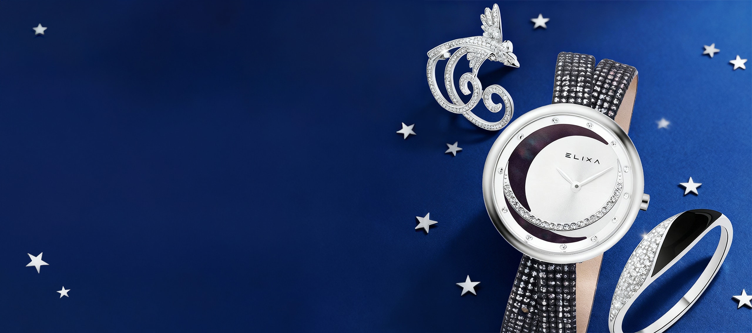 banner New Year's sales up to 70% - silver brooch, silver Elixa watch, silver ring with cubic zirconia and enamel on a navy blue background