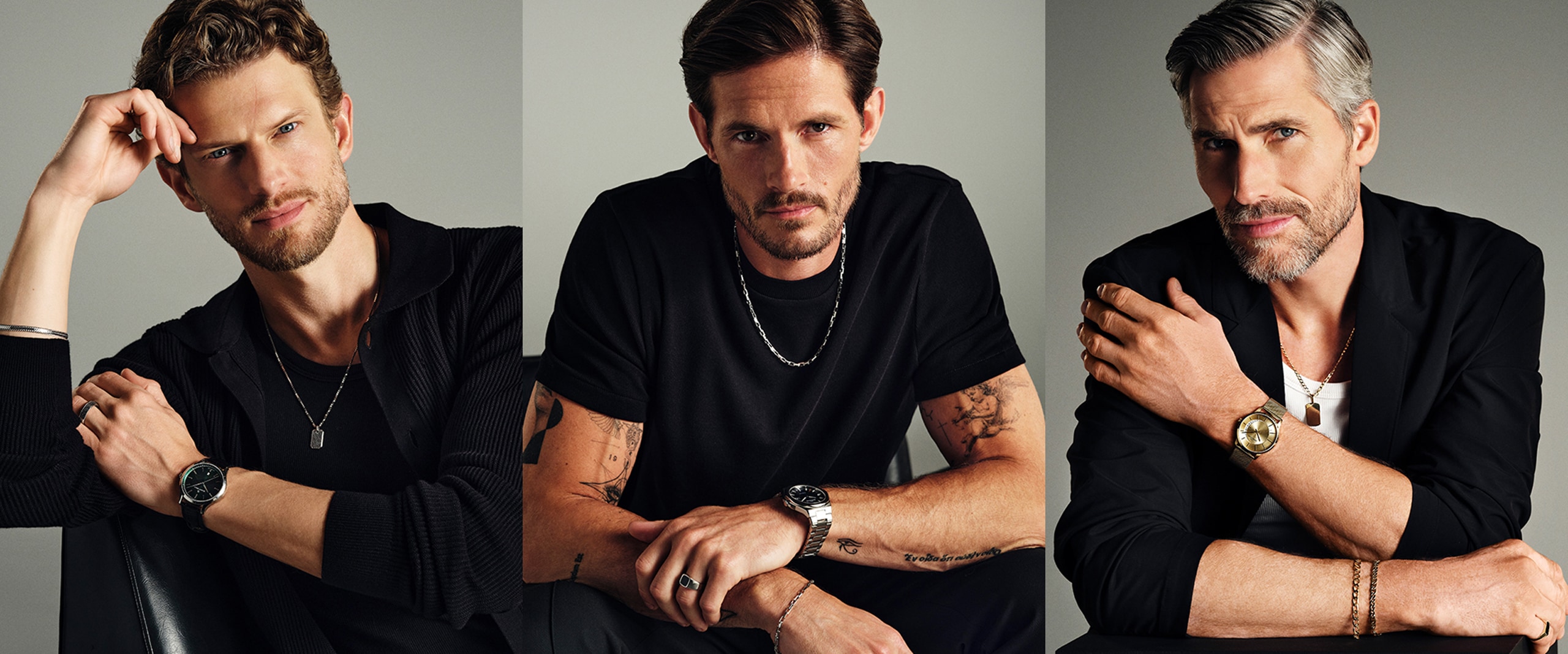 Three men dressed in black in men's jewellery styling