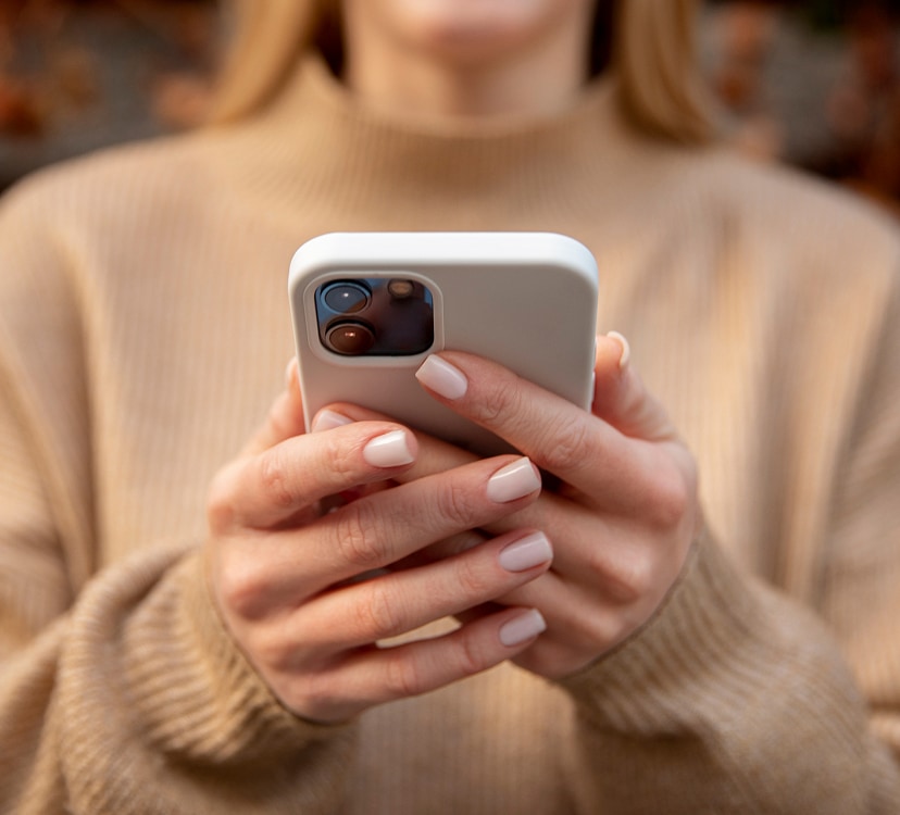 woman holding smartphone in her hands